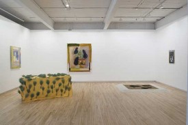 From left to right: Chalk Farm, (2009, oil on canvas, 39 x 34 inches;) Poires Noires (2009, oil and rayon string on canvas, 66 x 56 inches;) Jelly (2008, oil on canvas, 25 x 18 inches;); Drapery, after Yves Saint Laurent's coffin cover, (2009, cloth, dried wheat, spraypaint, table, 24 x 60 inches); sand painting on the floor, colored sand, 70 x 66 inches. Courtesy of the Artist