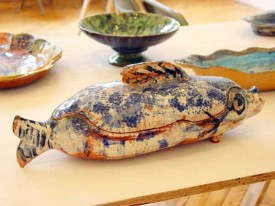 various ceramics by Ann Stokes, including, foreground Fish Tureen, nd, 6-3/4 x 19-1/4 inches. Courtesy of the Artist