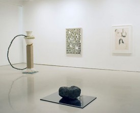 Installation shot of the exhibition under review showing, foreground, Demetrius Oliver Parallax, 2008. Digital c-print, anthracite