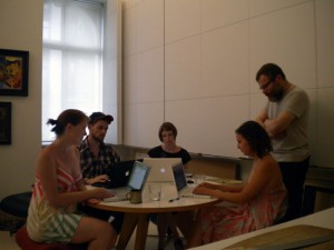 Editor/Publisher David Cohen (standing) with associates and interns Candace Mills (from left), Aaron Dunn, Karley Klopfenstein and Rachel Stratton, Summer 2010