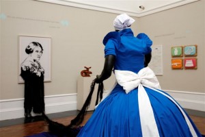 installation view of the exhibition under review, with, foreground, Mary Sibande, Conversation with Madam CJ Walker, 2009. Mixed media, life size synthetic hair on canvas. Courtesy of Gallery MOMO, Johannesburg
