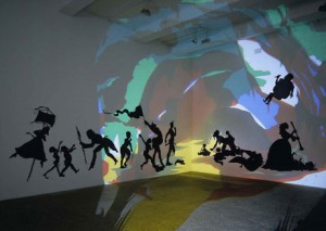 Kara Walker, Darkytown Rebellion, 2001, Cut paper and projection on wall, 14 x 37 feet overall, Musee d’Art Moderne Grand-Duc Jean, Luxembourg, Photograph courtesy the artist and Sikkema Jenkins & Co., New York