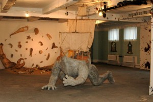 Newark Between Us: installation shot, showing (foreground) Daniel Harper Current 2006, mixed Media: wood, hardware cloth, aqua, and Daniel Rosenbaum Oasis 2006, mixed media, 125 x 135 inches