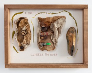 Alison Knowles, A Rolling Stone Gathers No Moss, 2011. Found materials, acrylic, raw flax, hand stamps Raw cotton, hardwood maple, tea stained frame 17 1/4 x 22 1/2 x 4 Inches. Courtesy James Fuentes LLC