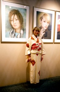 Ayando Sudo in front of two of her works. Photo by Robin Siegel