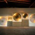 Günther Uecker, Five Light Disks, Cosmic Vision, 1961-1981. Nails on cavnas on wood, wooden case, electric motor, spotlight, 94-1/2 x 283-1/2 x 15-3/4 inches. Courtesy of L&M Arts, New York
