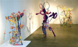 Installation shot of Polychrome: Peter Reginato at Heidi Cho Gallery, March 19 to April 16, 2011 showing (center) Dear Purple, 2011, stainless steel and enamel, 88 x 80 x 46 inches.