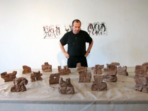 Alain Kirili in his New York studio with clay maquettes of the elements of Résistance
