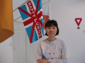 Eunah Kim with her "Happy Lungs" flag, Cambridge, Mass., May, 2009. Courtesy of Hyewon Li