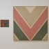 Installation shot of Black Mountain College and Its Legacy exhibition, Loretta Howard Gallery, New York, 2011 showing two works by Kenneth Noland: V. V., 1949. Oil on canvas, 15 x 18 inches and (right) Soft Touch, 1963. Magna on canvas, 69 x 69 inches.