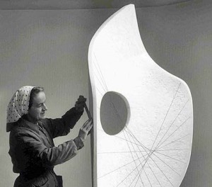 Barbara Hepworth holding a file with the plaster for Curved Form (Bryher II) (November 1961) © Bowness, Hepworth Estate
