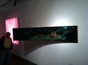 A visitor admires works by Leo Villareal and Erik Thor Sandberg at Conner Contemporary Art's booth at Pulse. Photo by David Cohen for artcritical