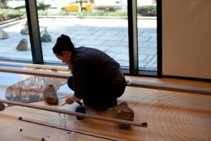 Sarah Sze at work on her installation at the Asia Society