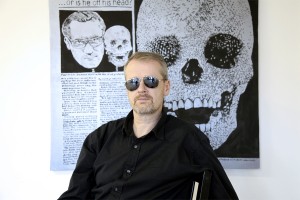 Rupert Goldsworthy in his studio and Damien Skull in the Daily Mail, 2011. acrylic and Flasche on wood, 23 x 36 inches.Courtesy of Rupert Goldsworthy
