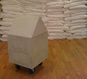 Installation shot of the exhibition under review with House, foreground, and detail of Wall. Courtesy of Y Gallery