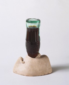 Marisol (Marisol Escobar), Love, 1962. Plaster and glass (Coca-Cola bottle), 6-1/4 x 4-1/8 x 8-1/8 inches. Museum of Modern Art, New York. Gift of Claire and Tom Wesselmann. © 2012 Marisol