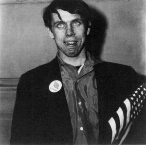 Diane Arbus,?Patriotic young man with a flag,?1967. Gelatin silver print,?14 x 14 inches. Reproduced in the book under review.