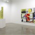 installation shot of the exhibition under review with Thomas Scheibitz, Standard, 2011, MDF, wood, vinly, lacquer and spray paint, 55-1/2 x 26-3/4 x 5-1/8 inches, to right, and A Panoramic VIEW of Basic Events, 2011 [details in preceding slide] to right. Courtesy of Tanya Bonakdar Gallery
