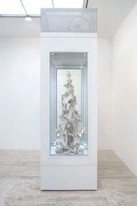 Larry Bamburg, Bone Stack #31 Shown at 60in center, Frozen, 2012. Bones, bespoke display freezer, 136 x 42 x 42 inches. Courtesy of Hauser & Wirth