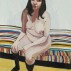 Chantal Joffe, Self-Portrait Sitting on a Striped Chaise Lounge, 2012. Oil on board, 72-1/8 x 47-7/8 inches. Courtesy of Cheim & Read