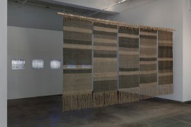 Installation view, exhibition under review, of Beryl Korot, Text and Commentary, 1976-1977. Five-channel video installation, black and white, with weavings, drawings, pictographic video notations, 30 minutes, stereo sound. Photo by John Berens. Courtesy of bitforms gallery nyc.