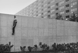 Jens S. Jensen, Boy on the Wall, Hammarkullen, Gothenburg, 1973. Photograph of Michael (age 9). Gelatin silver print, 9-1/2 x 11-3/4 inches. The Museum of Modern Art, New York. Gift of Jens S. Jensen, 2012