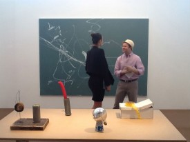 Lisa Pomares and a client view a work by Stefan Sandner (Untitled 2008) at American Contemporary, Nada Miami Beach, 2012