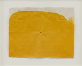 Suzan Frecon, yellow-orange on more conventional format with 3 holes, 2012. Watercolor on found old Indian paper, 13-1/2 x 17-1/2 inches. Courtesy of David Zwirner, New York