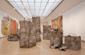 El Anatsui, Waste Paper Bags, 2003-2010, aluminum printing plates, paint and copper wire, seven pieces, dimensions variable. Courtesy of the artist and Jack Shainman Gallery, NY. Brooklyn Museum photograph.