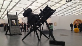 Work by Marianne Vitale, foreground, on view at Frieze Art Fair 2013, Randall's Island, with an exhibition of Tom Friedman at Luhring Augustine's booth in the distance. Courtesy of Frieze