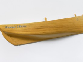 Ian Hamilton Finlay, Hommage A Rivière, 2002, wooden half boat, 7 7/8 x 30 3/4 x 4 3/4 inches, IF4633. Image courtesy of David Nolan Gallery.