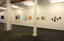 David Cohen and Will Cotton in front of a work by Duncan Hannah