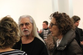 C. Michael Norton and Leslie Wayne converse with Nicole Wittenberg, back to the camera