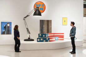 Installation shot of the exhibition under review including the Moloch floor lamp, 1970-71, by Gaetano Pesce , Richard Hamilton’s Epiphany, 1964), Leonardo, Sofa, 1969 by Studio 65 and Fiche Male (Plug Socket) 1977 by Yonel Lebovici © Gar Powell-Evans 2013 Courtesy Barbican Art Gallery