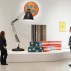 Installation shot of the exhibition under review including the Moloch floor lamp, 1970-71, by Gaetano Pesce , Richard Hamilton’s Epiphany, 1964), Leonardo, Sofa, 1969 by Studio 65 and Fiche Male (Plug Socket) 1977 by Yonel Lebovici © Gar Powell-Evans 2013 Courtesy Barbican Art Gallery