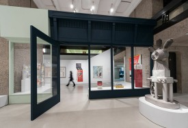 Installation shot of the exhibition under review, including works by Eduardo Paolozzi and David Hockney © Gar Powell-Evans 2013 Courtesy Barbican Art Gallery