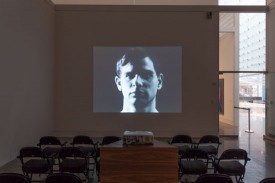 Installation view featuring The Thirteen Most Beautiful Boys Screen Tests, "13 Most Wanted Men: Andy Warhol and the 1964 World's Fair," 2014, The Queens Museum. Courtesy of the Queens Museum.