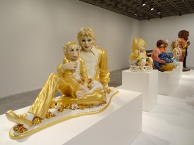 Installation shot of the exhibition under review. Foreground: Jeff Koons, Michael Jackson and Bubbles, 1988. Porcelain, 42 x 70-1/2 x 32-1/2 inches. (c) Jeff Koons