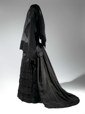 Mourning Ensemble, 1870-1872. Black silk crape, black mousseline. Veil, ca. 1875. Black silk crape. Photo: © The Metropolitan Museum of Art, by Karin L. Willis.