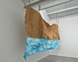 Karla Black, Prevent, 2014. Brown paper, paint, brown tape, nail varnish, 74 1/8 x 181 1/8 inches.