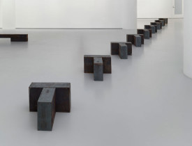 Richard Nonas, Skid (New-Word Chaser Series), 2014. Steel, 9 parts, each 20 x 20 x 12 1/4 inches. Courtesy of Fergus McCaffrey