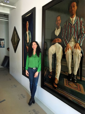Brenda Zlamany with examples of her portrait paintings in her Williamsburg studio. Photo: Mary Jones, 2015