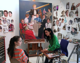 Brenda Zlamany painting her daughter Oona in her Williamsburg studio, 2015. In the background, portrait commission destined for Yale University Sterling Library with working materials. Photo: Mary Jones