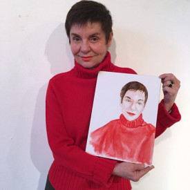 Ariane Lopez-Huici holding "Watercolor Portrait a Day" #220 by Brenda Zlamany. Photo: Brenda Zlamany