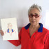 Katherine Bradford holding "Watercolor Portrait a Day" # 7 by Brenda Zlamany. Photo: Brenda Zlamany