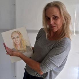 Kyle Staver holding "Watercolor Portrait a Day" #153 by Brenda Zlamany. Photo: Brenda Zlamany