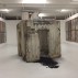 Anselm Kiefer, Geheimnis der Farne, 2007. Installation of 48 pictures and two concrete sculptures, clay argile, ferns, emulsion and concrete. Two 55-foot long parallel walls of connected images. At Margulies Collection at the Warehouse, Miami, FL.