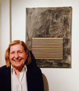 Photo of Regina Bogat with her painting Hammill, 2014. Courtesy of Zürcher Gallery, New York