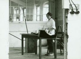 Photo of Eva Hesse in the Textile Factory Studio, Kettwig, Germany, 1964. Photographer unknown.