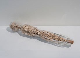 Fred Holland, Woman with 1,000 Eyes, 2015. Cast glass, black eyed peas, and cork, 2-1/2 x 17 x 3 inches. Courtesy of Tilton Gallery